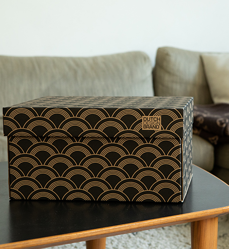 Vinyl Storage Box with a print depicting overlapping vinyl record like shapes in black and gold.