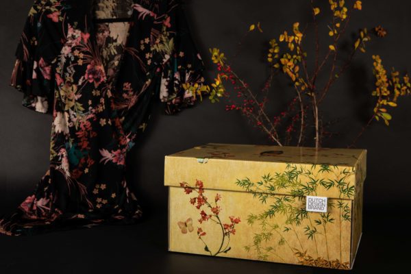 Japanese Blossom Storage Box with a bamboo and cherry blossom print on a faded parchment background.