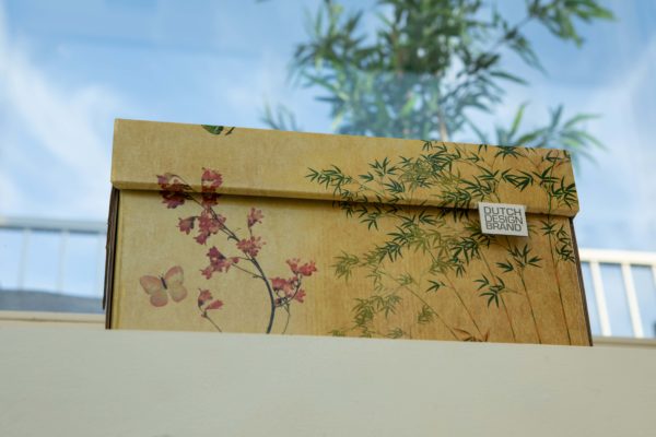 Japanese Blossom Storage Box with a bamboo and cherry blossom print on a faded parchment background.