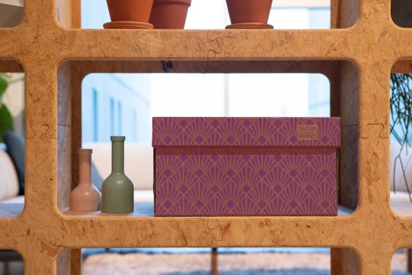 Storage Box Art Deco Velvet Violet. The box is decorated with a 20s geometric Art Deco print in violet and gold.